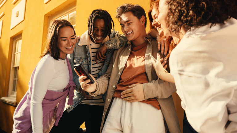 friends group looking at a phone