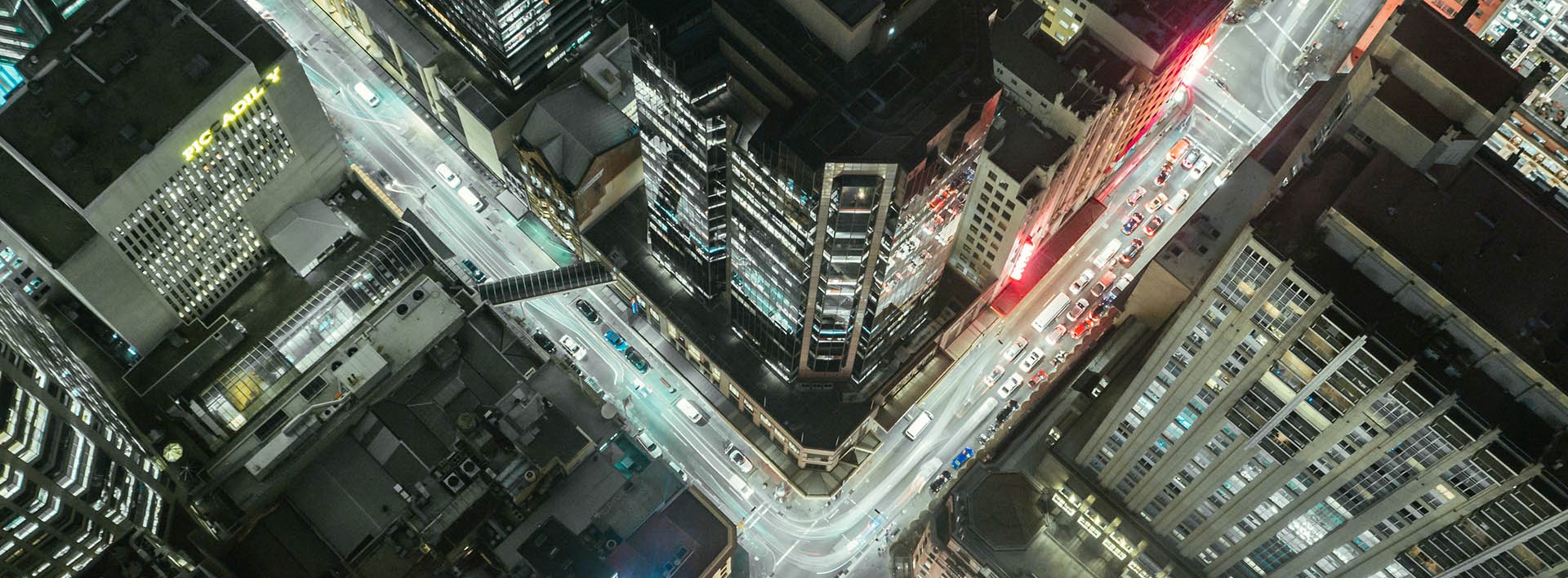 city at night with lights in buildings