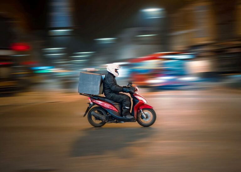 food delivery person on a motorbike
