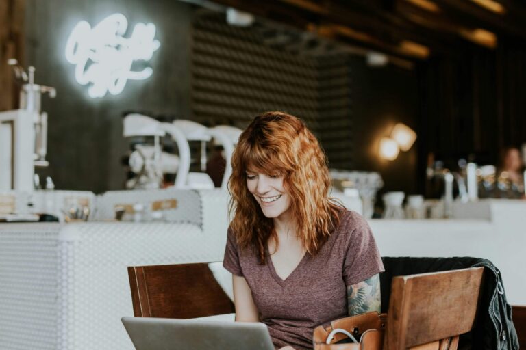 woman on her laptop in a cafe
