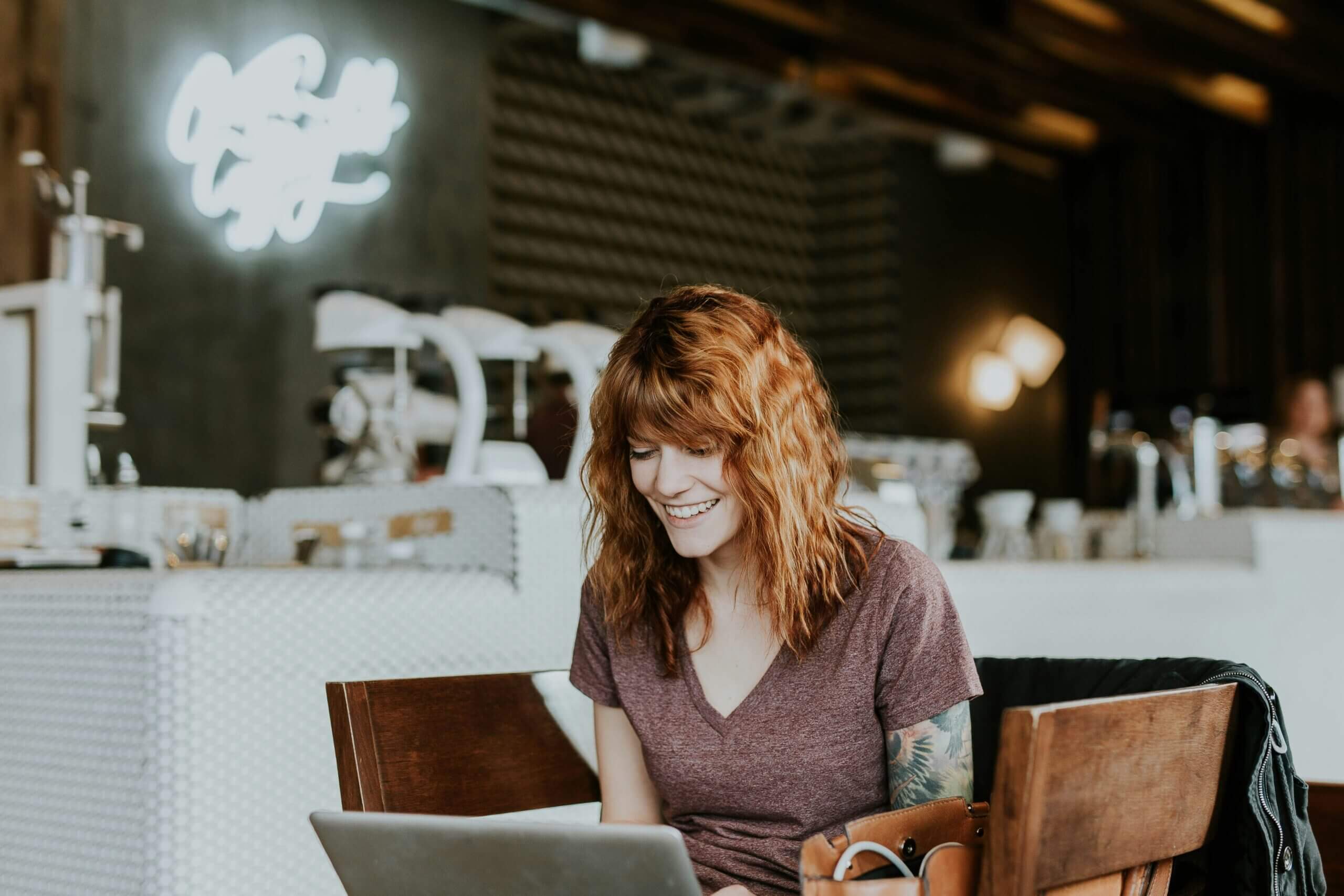 woman on her laptop in a cafe