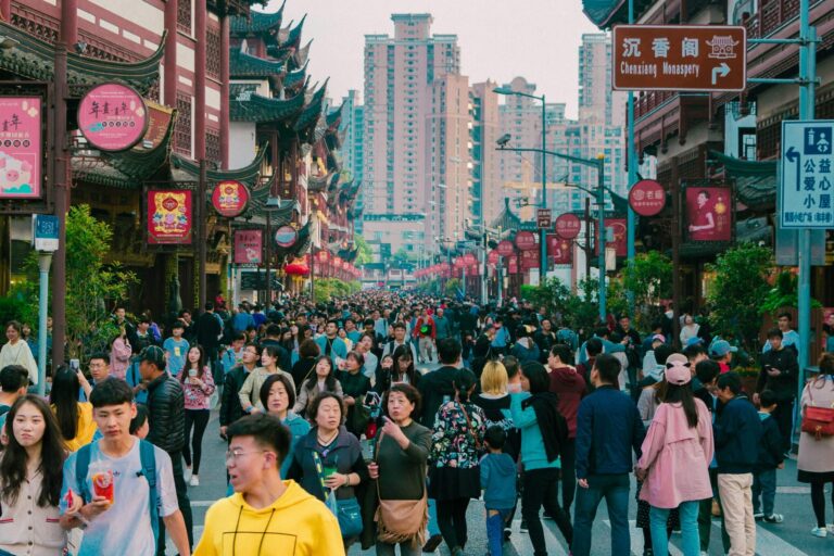 crowd of people walking on the street in China