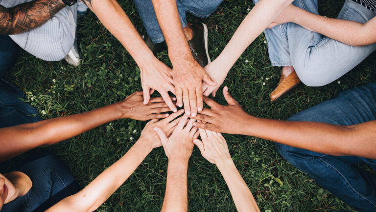 people putting hands together