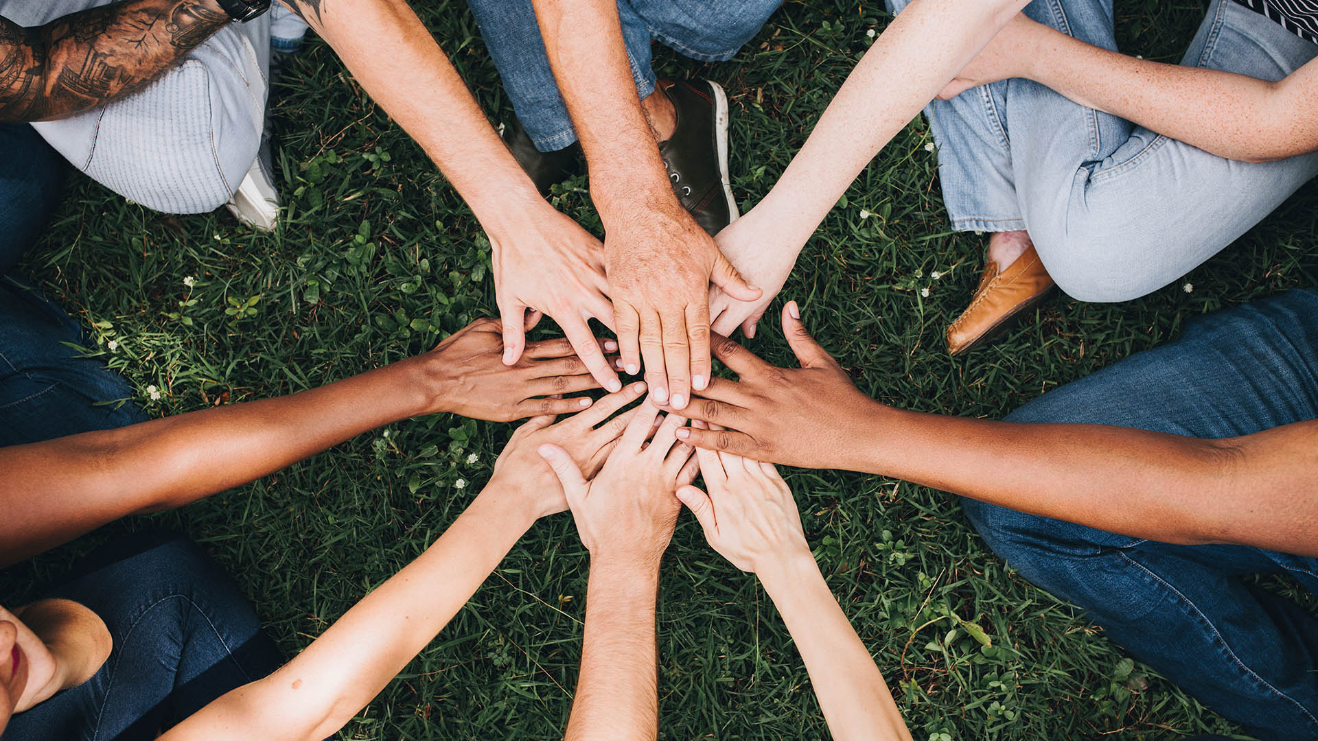 people putting hands together