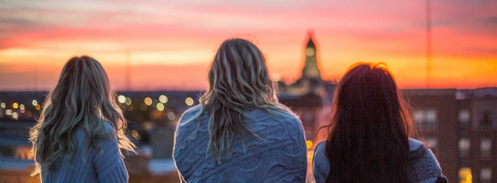 three women looking out to the horizon
