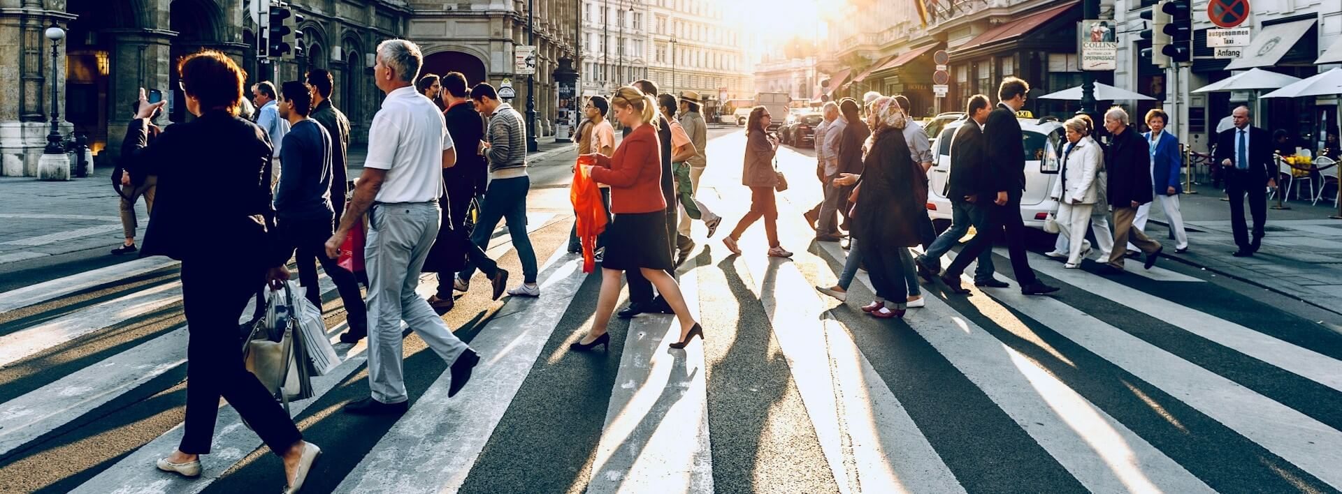 people walking on a crossing